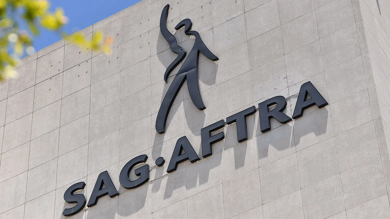 A SAG-AFTRA logo displayed on signage outside an office building