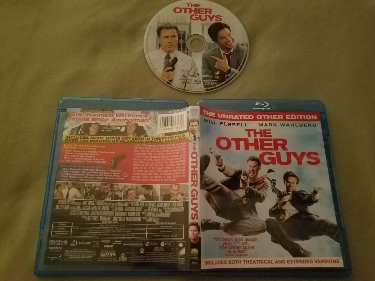 A hand holds a DVD case with an unrated edition label on the cover in a living room setting