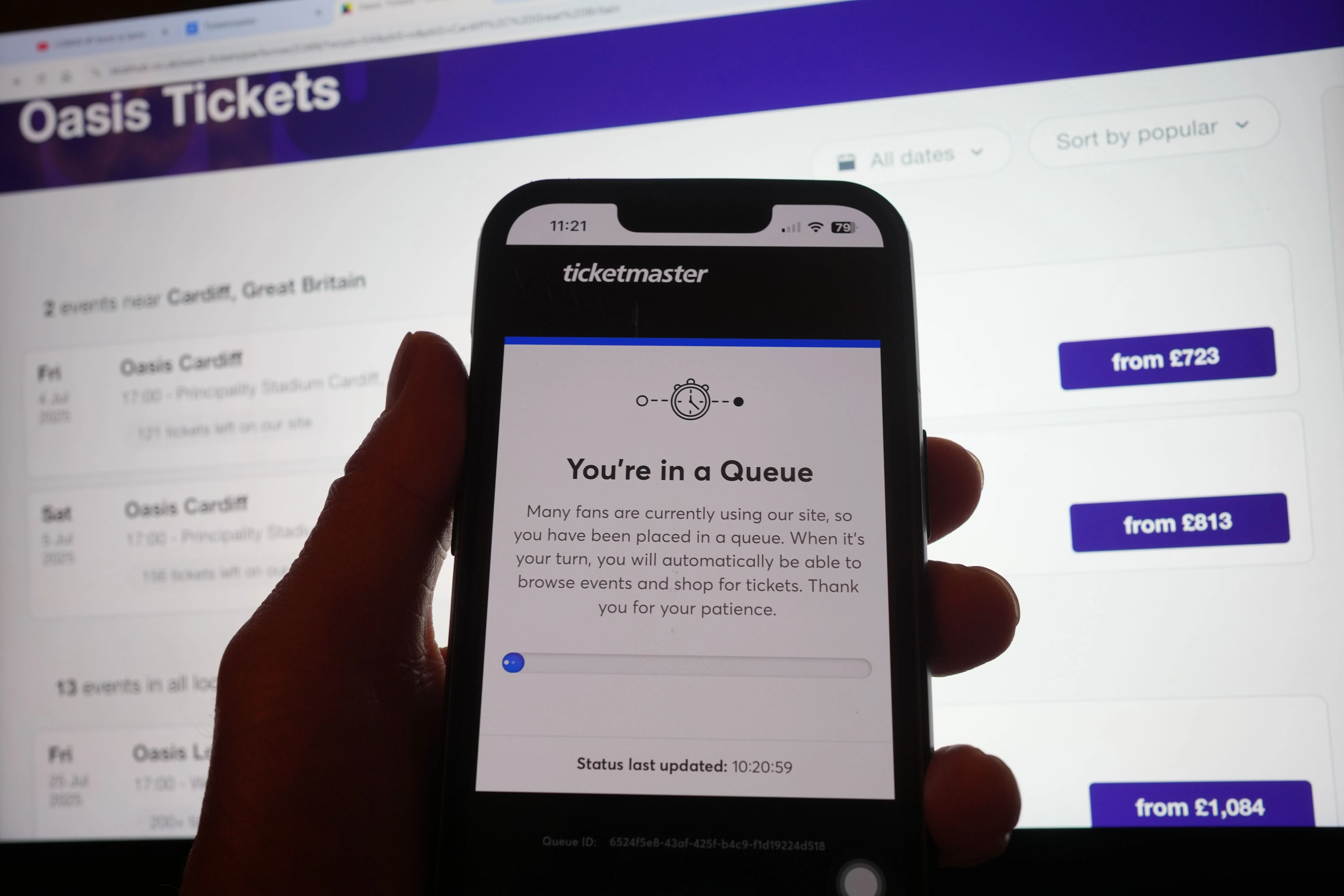 A theater ticketing website displayed on a laptop, showing a color-coded venue layout with multiple sections and different prices listed for seats