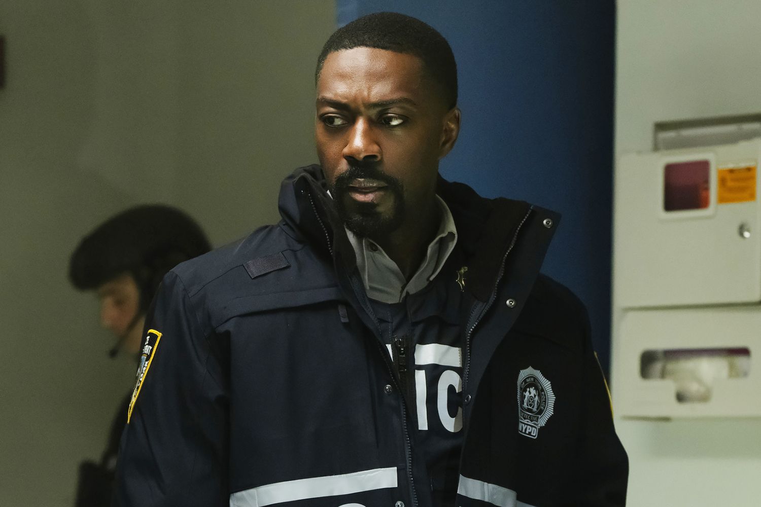 David Ajala in character on Law & Order during a scene set on a city street.