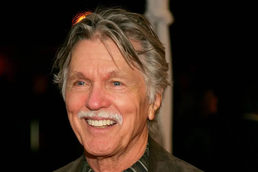 Tom Skerritt in a formal portrait, facing the camera, wearing a dark jacket